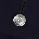 Close-up of silver-toned button with emblem on vintage Italian military police trench coat fabric.