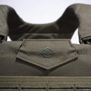 Close-up of PENTAGON Milon Plate Carrier Mk2 tactical vest in olive green Cordura 500D fabric with logo detail.