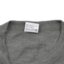 Close-up of gray Belgian military thermal flame-resistant undershirt showing fabric tag and round neckline stitching