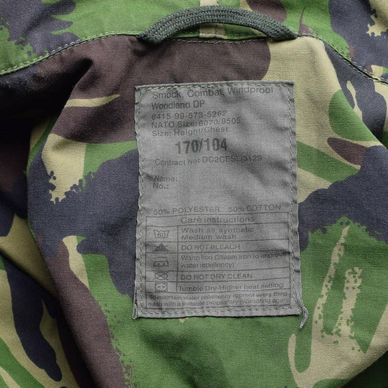 Close-up of label inside a genuine British military DPM camouflage combat smock showing size and care instructions