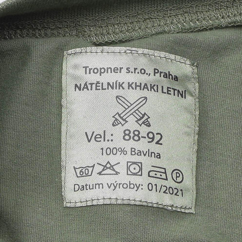 Close-up of label on genuine Czech Army olive green first layer military underwear t-shirt showing size and care instructions