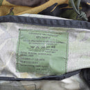 Close-up of the label inside Genuine Dutch Military woodland DPM backpack with model and care details visible