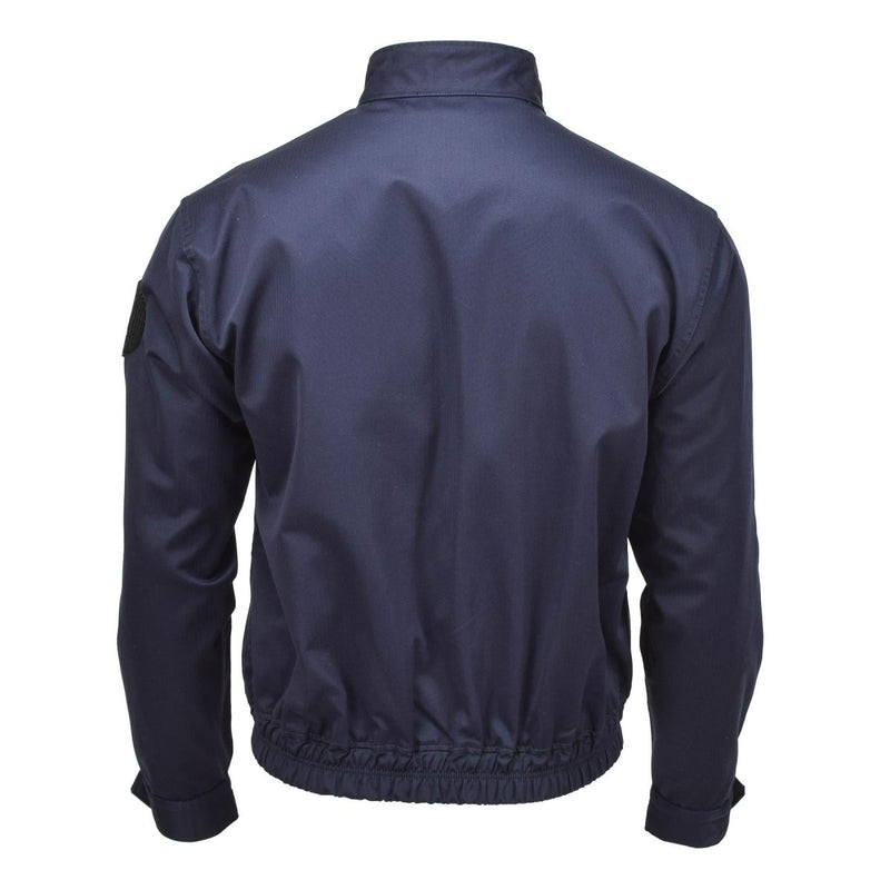 Back view of a navy blue French military police jacket with elastic waistband and adjustable cuffs.