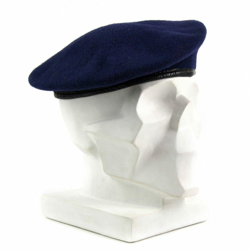 Genuine German army dark blue wool beret with leather command cap trim displayed on white mannequin head