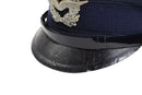 Close-up of vintage German Luftwaffe Air Forces blue peaked cap with silver insignia and black visor