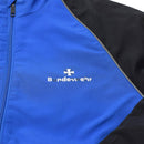Close-up of blue and black Bundeswehr sports jacket with zip front and reflective piping detail.