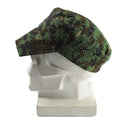 Genuine Guinea Bissau digital jungle camouflage army cap with brim and adjustable strap on white mannequin head.