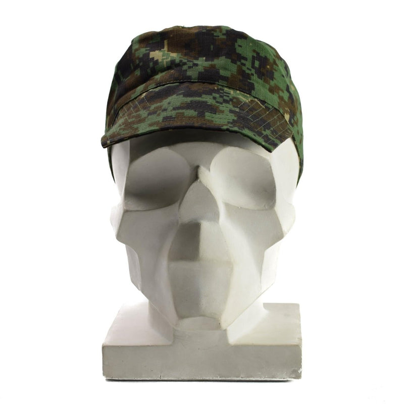 Genuine Guinea Bissau army cap in digital jungle camouflage on a white mannequin head with brim and adjustable strap.