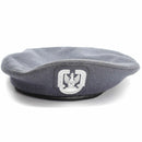 Genuine Polish military grey wool paratrooper beret with distinctive paratrooper badge, vintage air force headgear.