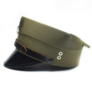 Vintage olive green Polish military officer peaked cap with black visor and eagle insignia on front