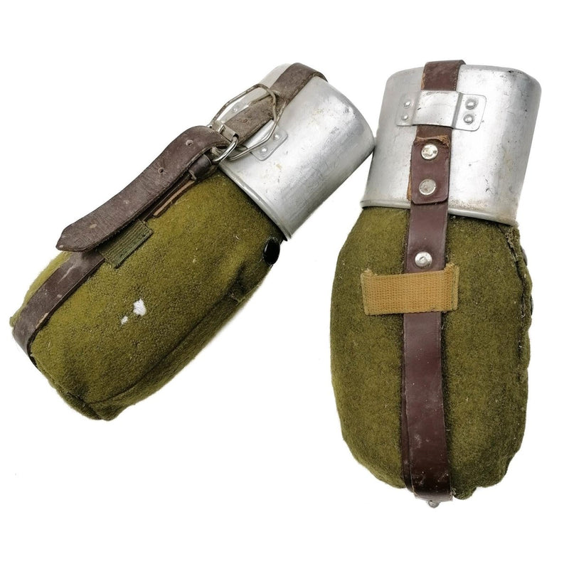 Vintage Romanian army metal canteen with green wool felt cover and leather strap, durable and collectible military flask.