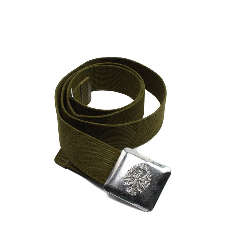 Vintage Spanish army belt made of canvas with a metal buckle featuring a detailed military emblem design.