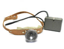 Vintage genuine Swiss Army headlamp flashlight with leather strap and metal battery pack from Swiss military Cold War era