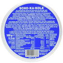 Round blue tin can of Scho-Ka-Kola German milk chocolate with caffeine, 100g, showing ingredient and nutrition labels.