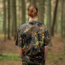 Rear view of person wearing MFH U.S. military-style BW camouflage lightweight breathable sportswear T-shirt in forest.
