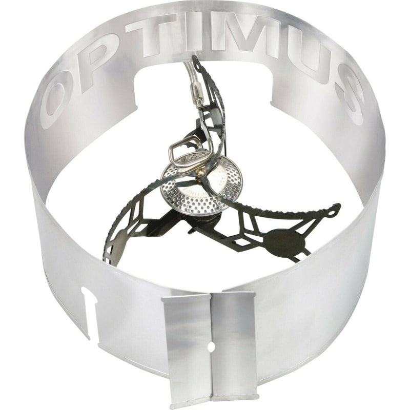 Lightweight Optimus Vega folding camp stove burner with built-in windshield for portable outdoor cooking.