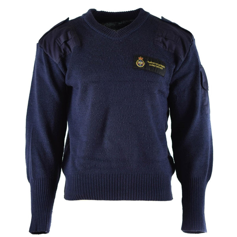 Original British Defence Service blue V-neck wool commando jumper with reinforced shoulders and patch pocket.