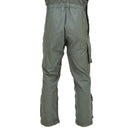 Back view of olive green flame-resistant aramid cargo bib pants with adjustable straps and multiple pockets.