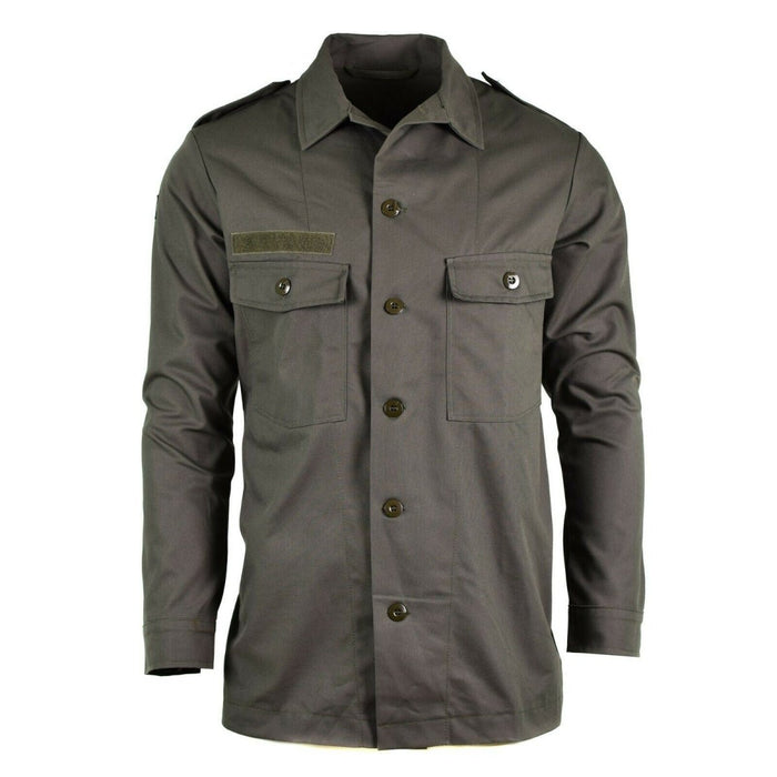 Origineel Nederlands leger M65 veldshirtjack in olijfgroen met borstzakken en epauletten, militaire stijl en duurzaam ontwerp.