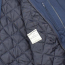 Close-up of the detachable quilted liner inside the blue Original Dutch military jacket for cold weather use.