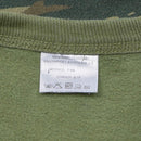 Close-up of care label inside an original Greek army lizard camo military sweatshirt showing washing instructions and size details.