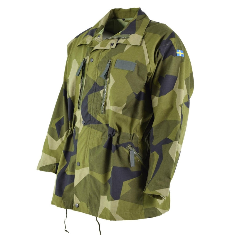 Original Swedish army M90 splinter camo jacket with multiple pockets and adjustable waist and cuffs for outdoor use.
