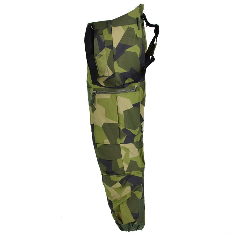 Original Swedish thermal tanker pants in M90 Splinter camouflage with suspenders and secure pockets for cold weather use