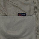 Close-up of olive tactical fleece jacket interior showing Polartec fabric label made in USA and mesh lining detail