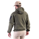 Man wearing olive green Pentagon Falcon PRO tactical knitted fleece sweater with hood and beige cap, back view