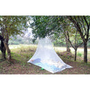 Mosquito net over a sleeping bag in a forest setting