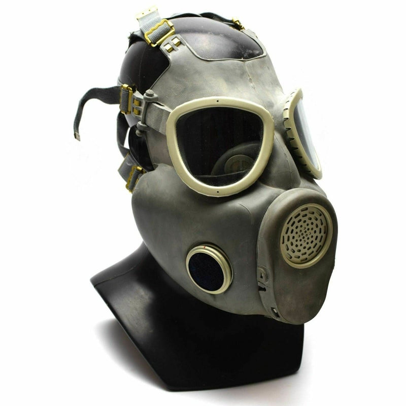 Polish Military MP4 gas mask in grey olive color with rubber facepiece and adjustable straps on display bust.