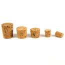 Set of five vintage tapered natural cork plugs for sealing bottles, jars, and containers in various sizes.